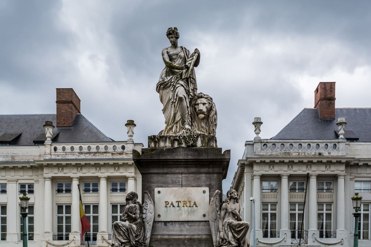 A solemn view of the Martyrs' Monument at Martyrs' Square in Brussels, symbolizing Belgium's fight for independence in 1830.