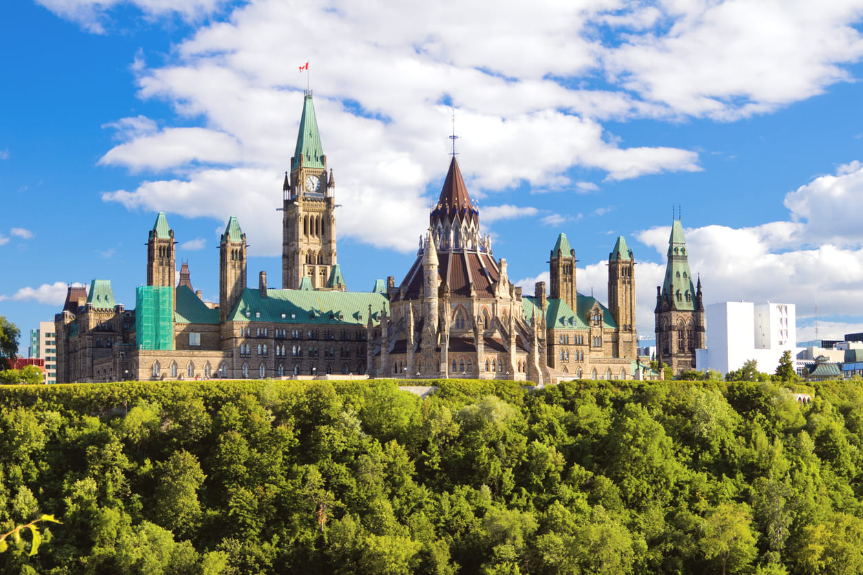 A majestic view of Parliament Hill in Ottawa, representing Canada's journey to legislative independence.