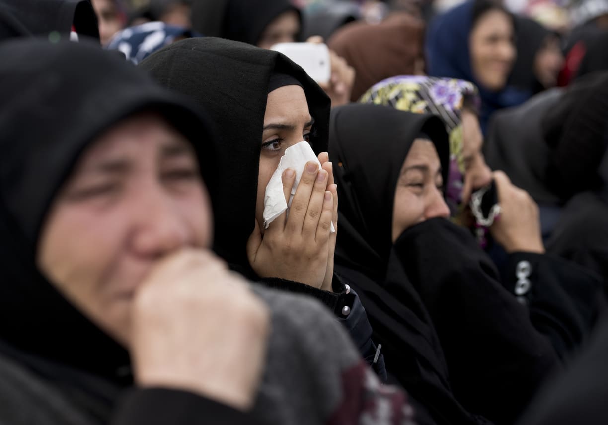 A group of grieving women dressed in black, expressing sorrow and devotion during Ashura commemorations.
