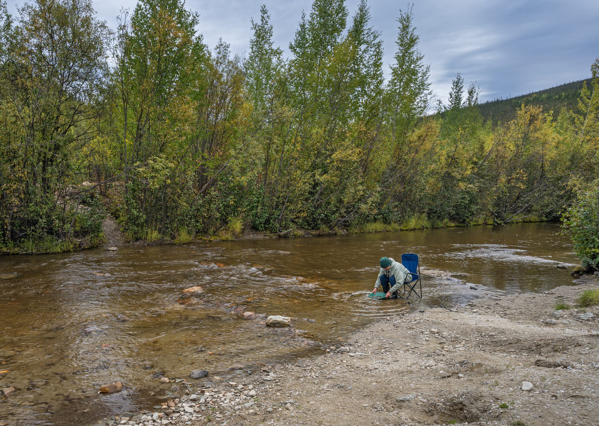 A man pans for gold at Bonanza Creek, the historic site of the Klondike Gold Rush discovery in Yukon.