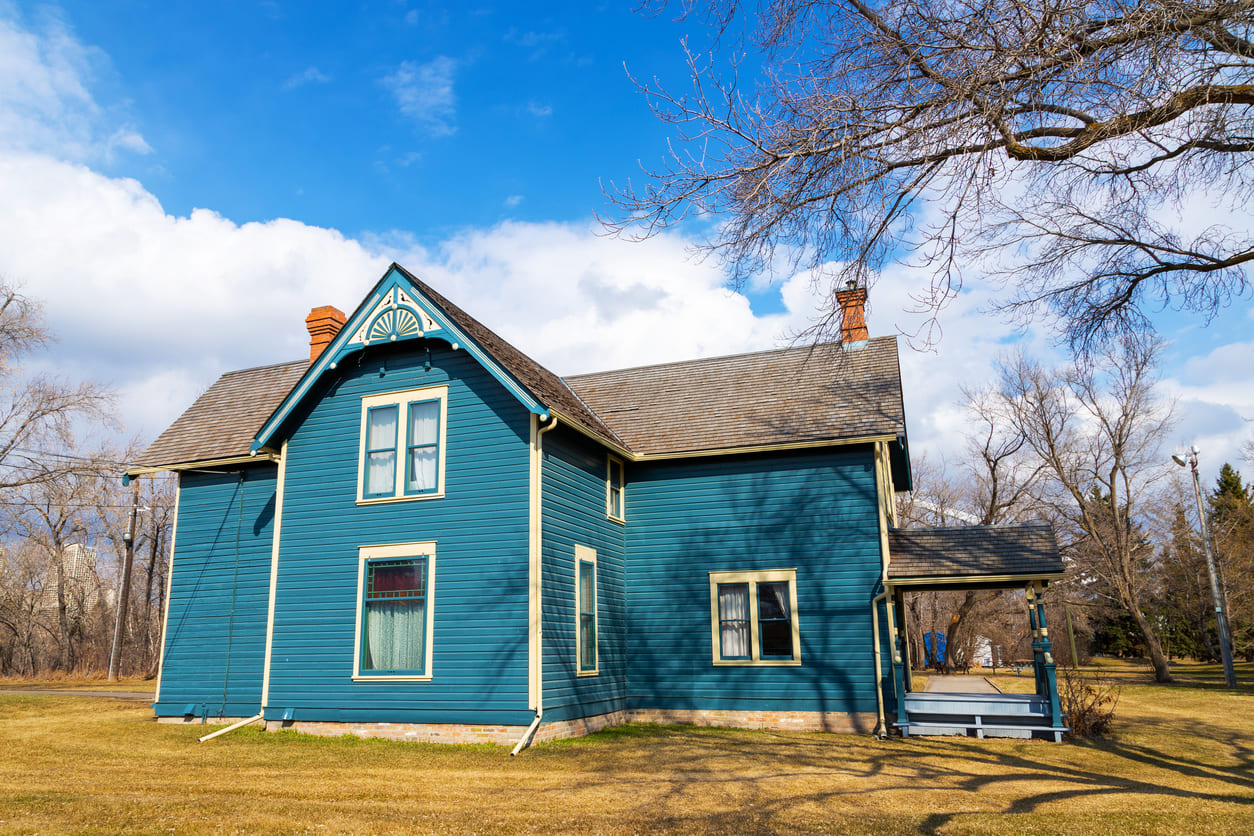 A beautifully preserved historic house at the John Walter Museum in Edmonton, Alberta, representing the province's early settler history and cultural heritage.