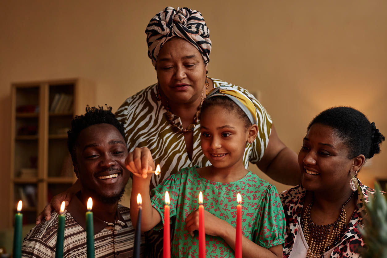 A joyful family lights the Kinara candles, embracing the traditions and values of Kwanzaa.