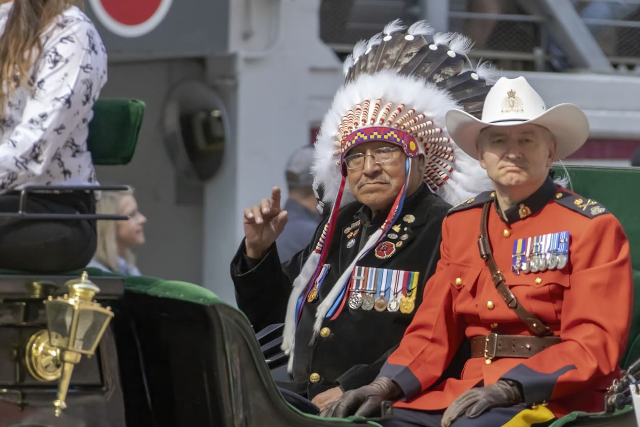 An Indigenous veteran in a traditional headdress, symbolizing honor, service, and recognition on National Aboriginal Veterans Day.