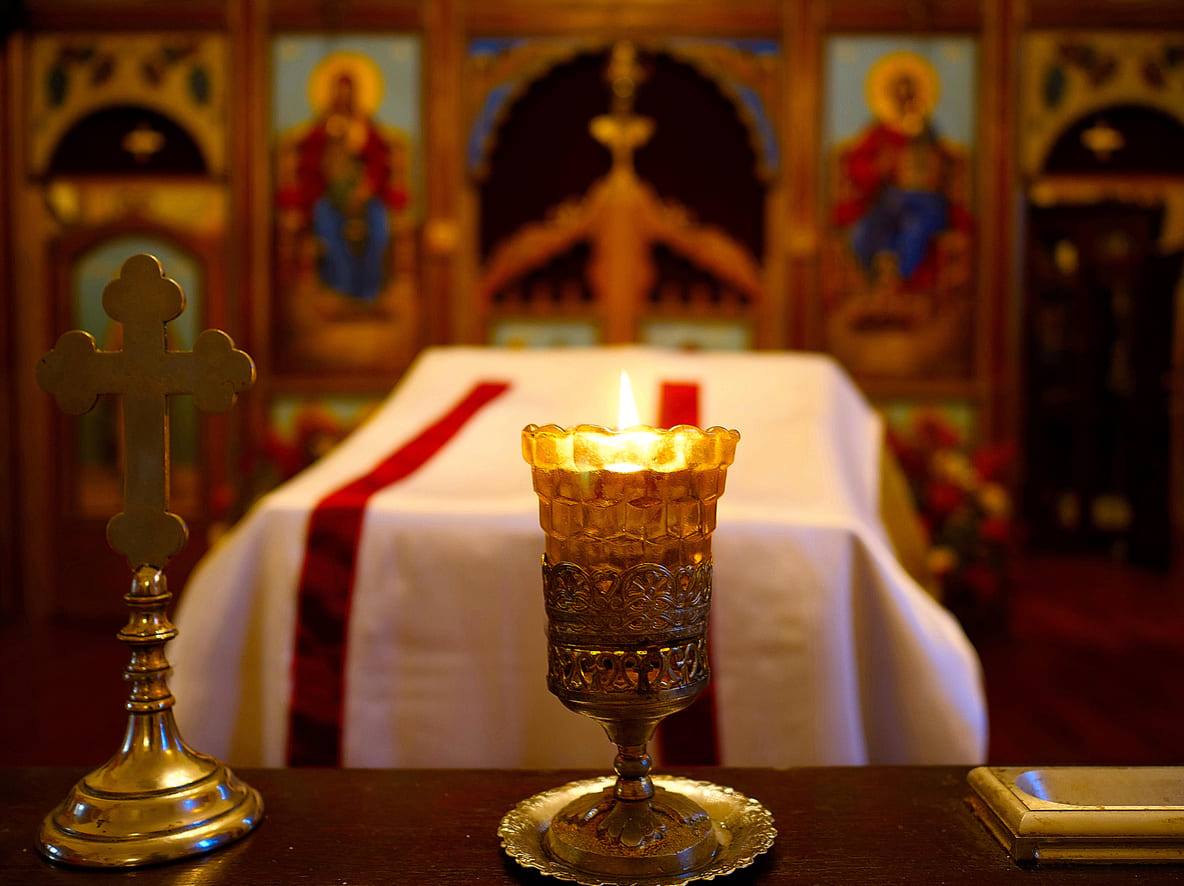 A solemn Orthodox Holy Saturday scene featuring the Epitaphios, candlelight, and sacred icons, symbolizing prayer and the anticipation of Christ's resurrection.