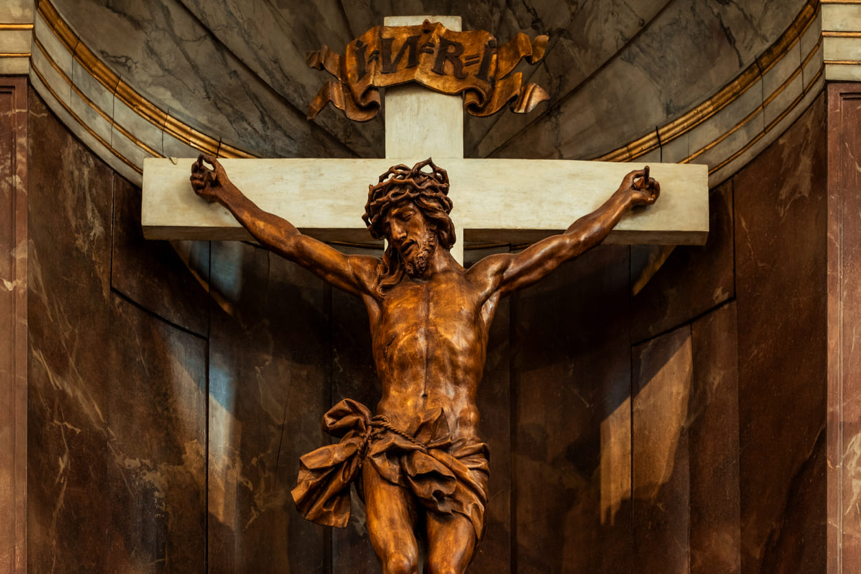 Wooden sculpture of Jesus Christ on the cross, representing his crucifixion and the solemn significance of Good Friday.