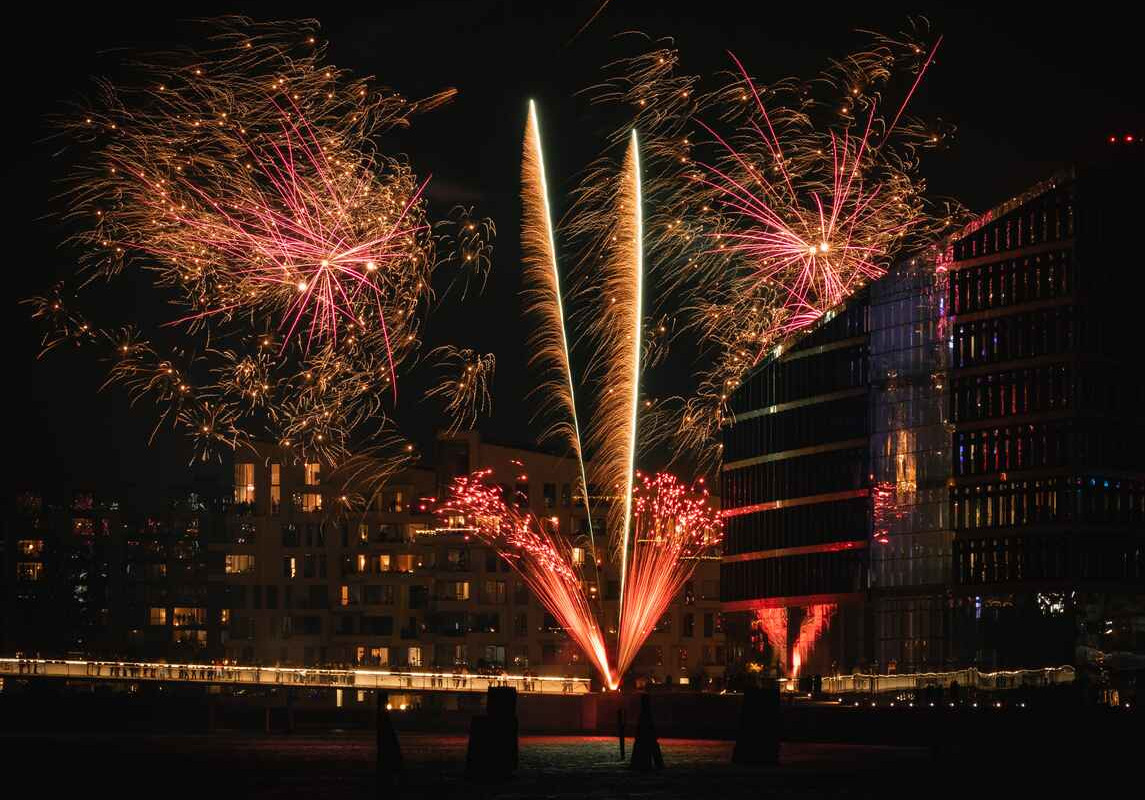 A dazzling display of fireworks illuminates the night sky over Copenhagen
