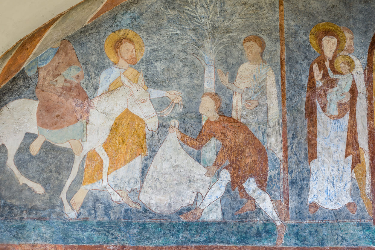 A historic fresco depicting Jesus' triumphant entry into Jerusalem on Palm Sunday.