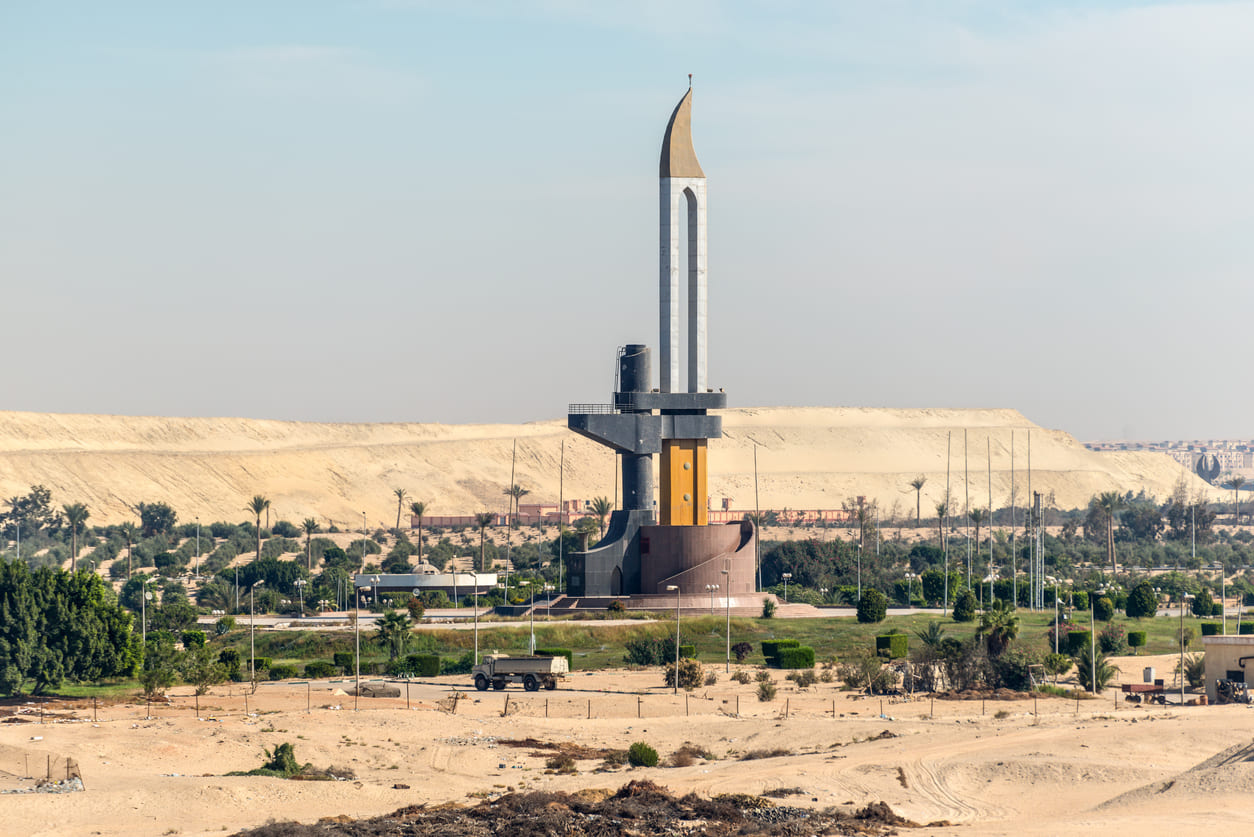 The Battle of Ismailia Monument rising from the desert landscape, symbolizing Egypt's military strength and 1973 war victory.