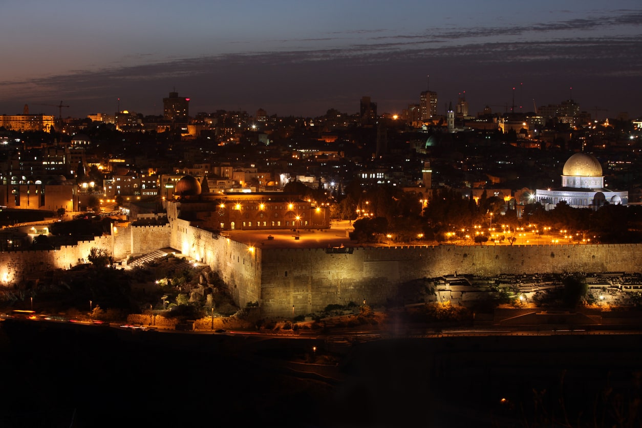 The Dome of the Rock in Jerusalem illuminated at night stands as a symbol of spiritual significance and history