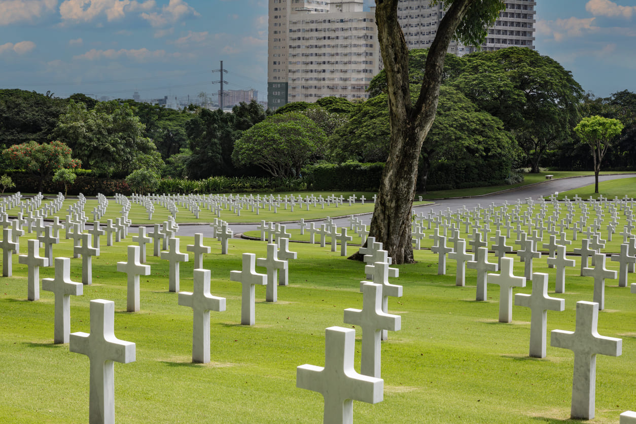 Endless rows of white crosses stretch across the green fields of the Manila American Cemetery, symbolizing remembrance, sacrifice, and national pride.