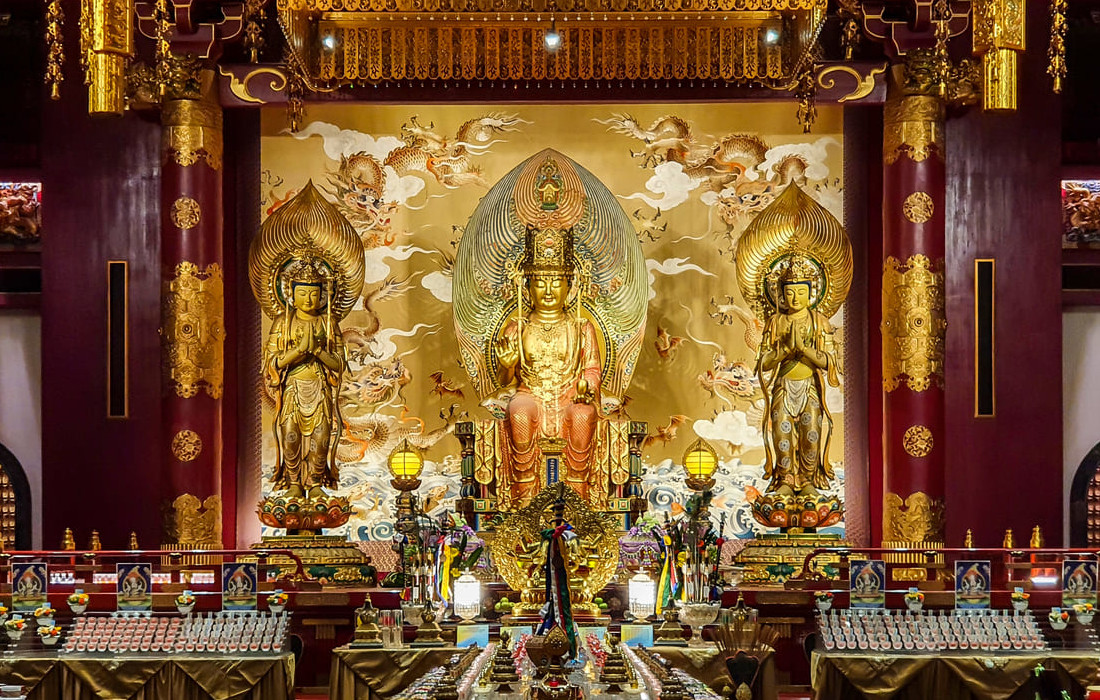 The Buddha Tooth Relic Temple in Chinatown, beautifully lit and decorated, creating a vibrant and sacred atmosphere for Vesak Day.