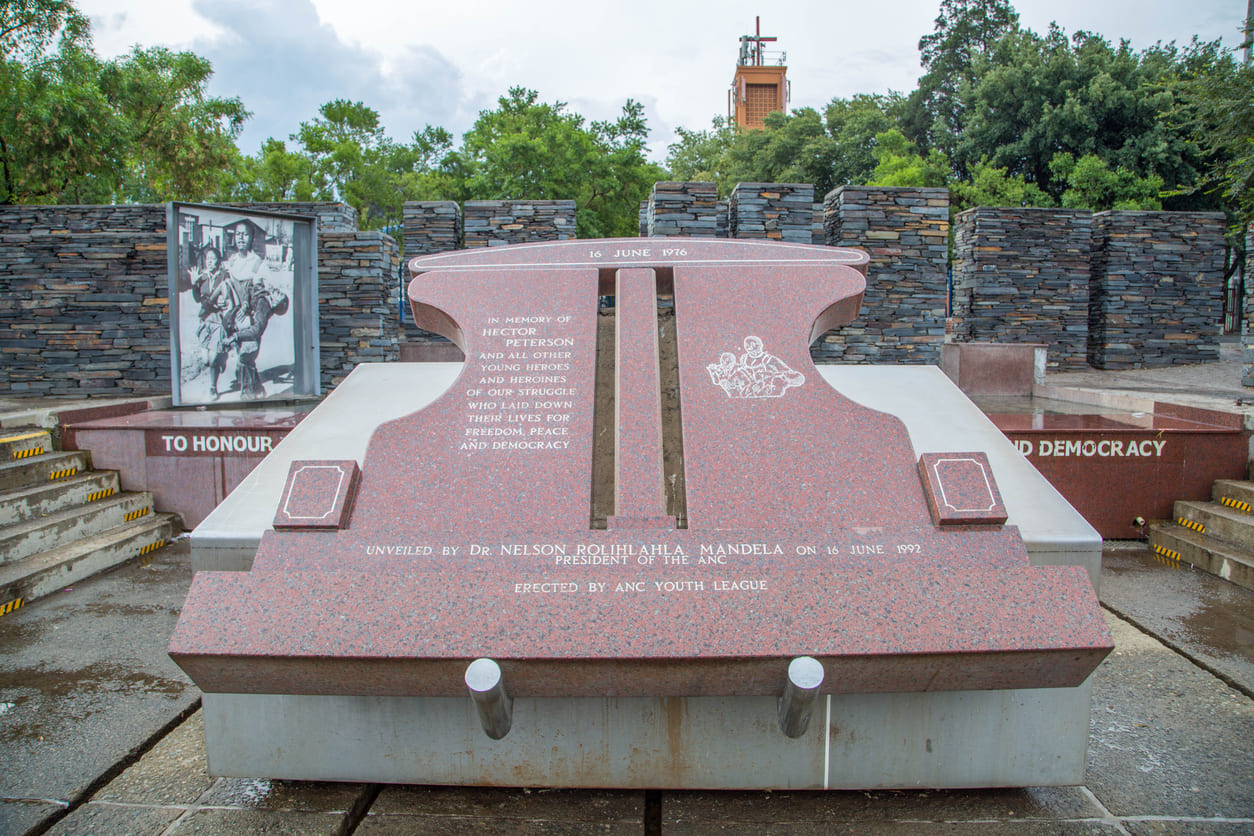 The Hector Pieterson Memorial in Soweto, featuring a symbolic red granite structure and a historical photograph honoring the 1976 student uprising.