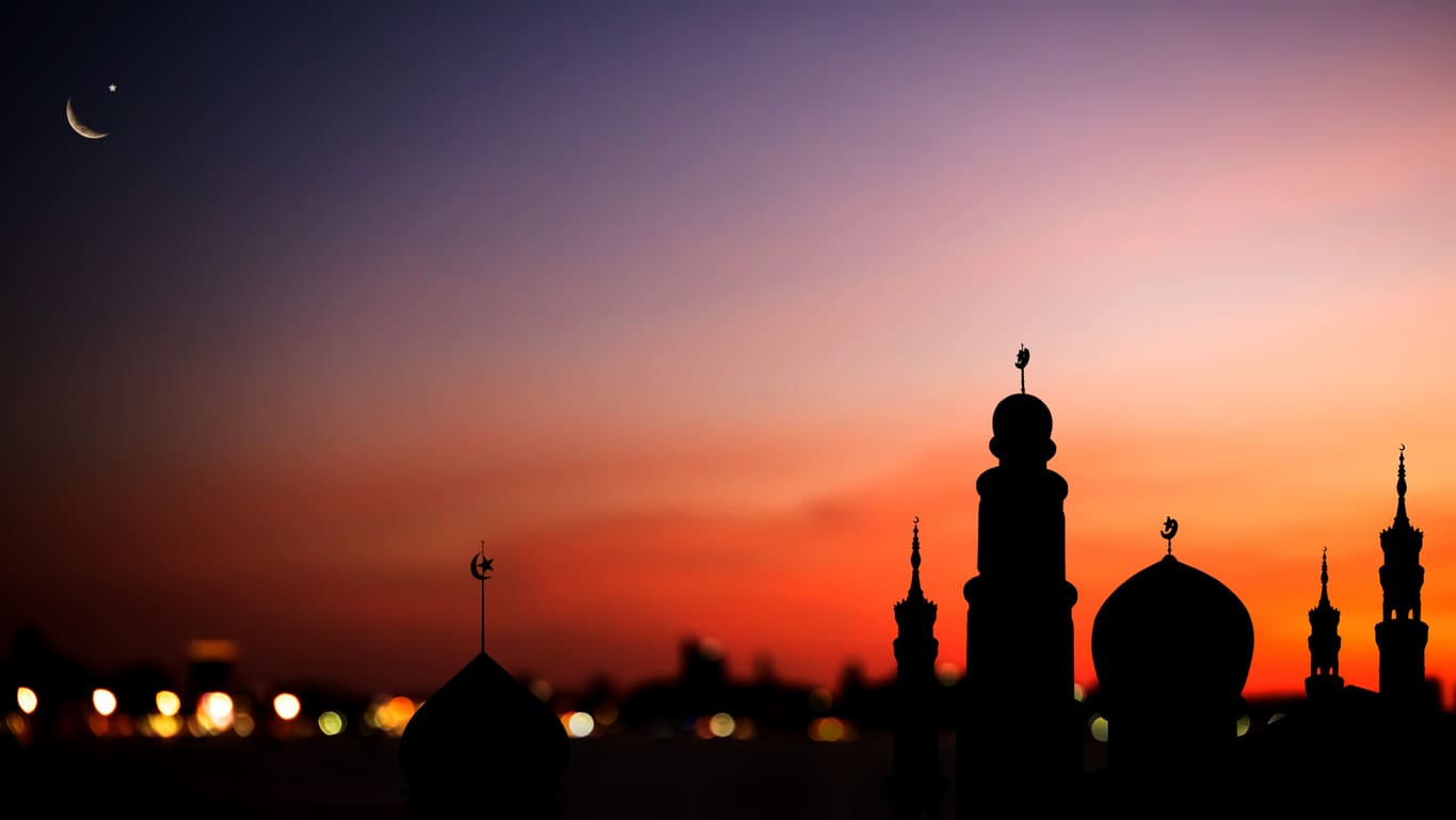 A serene evening sky with a crescent moon above mosque domes, capturing the spiritual essence of Al-Hijra and the Islamic New Year.