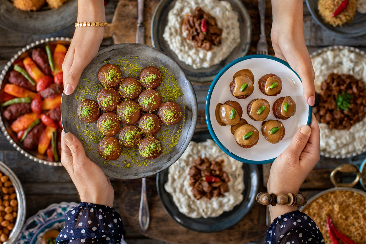A festive Eid al-Fitr table filled with traditional sweets and savory dishes, symbolizing celebration and togetherness.