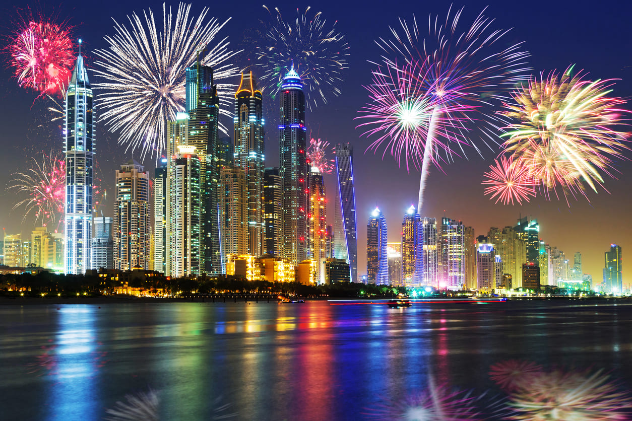A dazzling display of fireworks over Dubai's skyline, reflecting the vibrant celebration of New Year's Eve in the UAE.