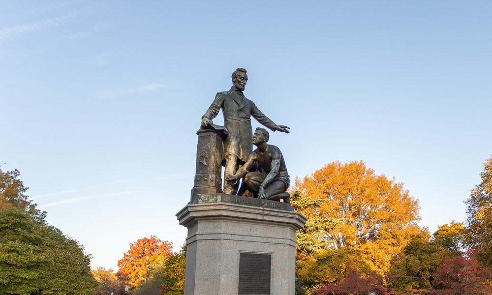 Emancipation Memorial statue in Washington, D.C., depicting Abraham Lincoln standing beside a kneeling freed slave.